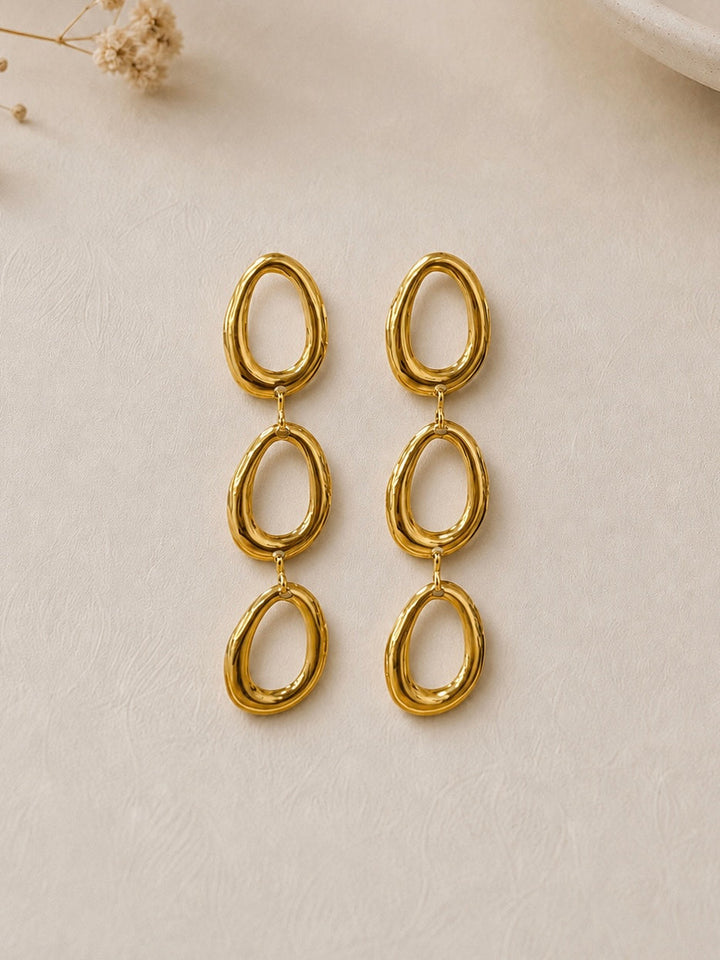 Pendientes cascada óvalos relieve dorados
