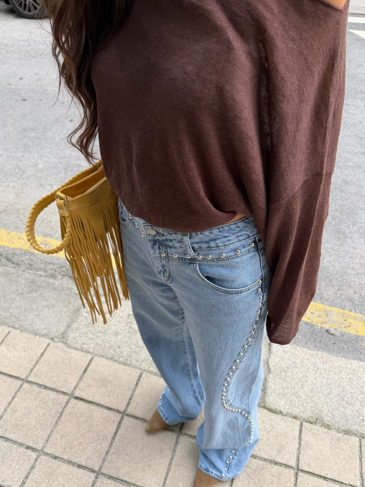 Jeans de denim con tachuelas