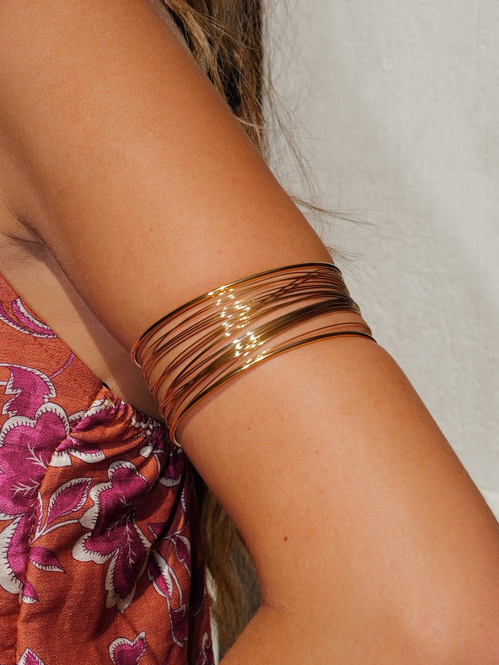 Brazalete aros cruzados dorado